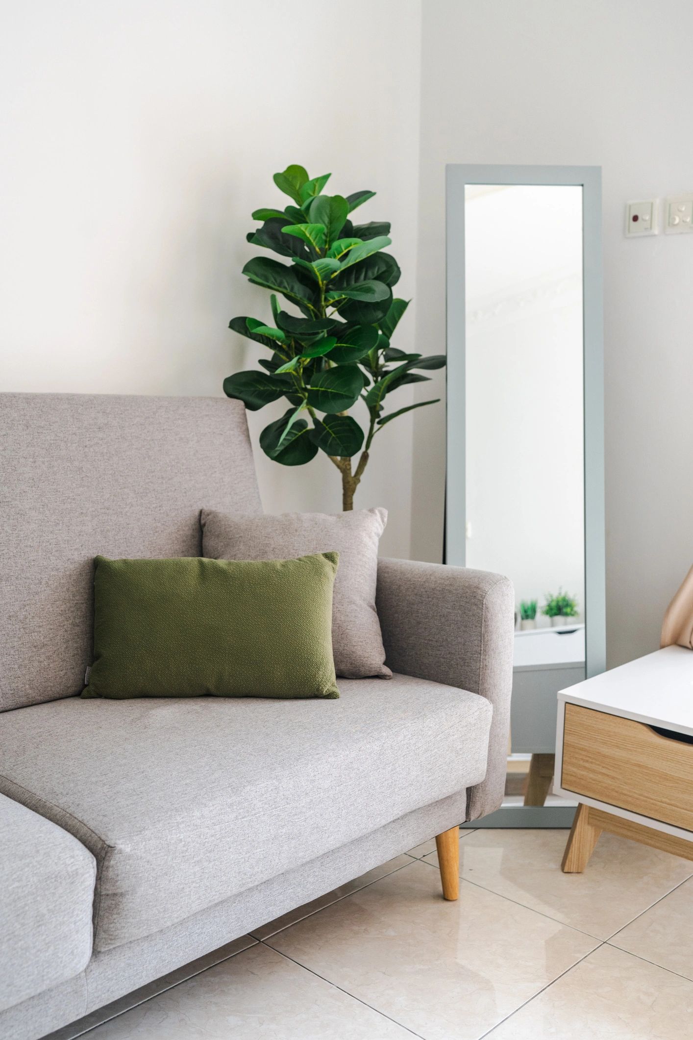 Curated living room with sofa, armchair, and home decor accents
